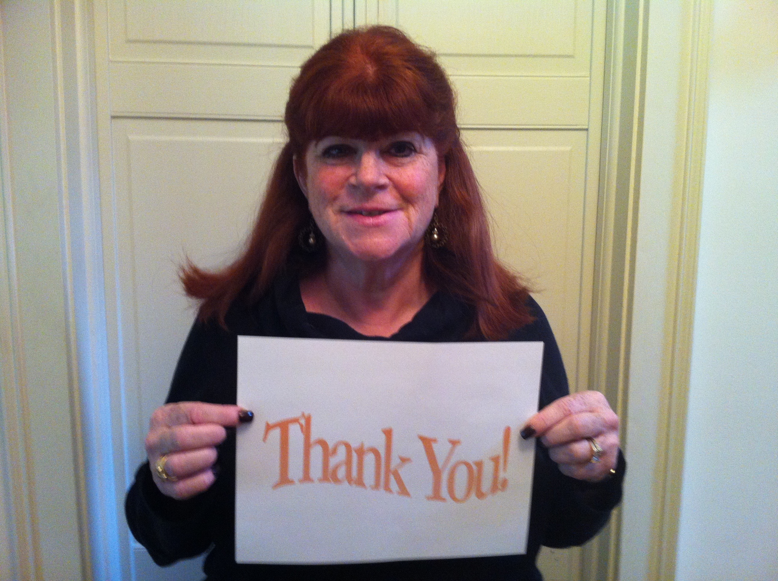 Deborah Appleman Holding Thank You Sign